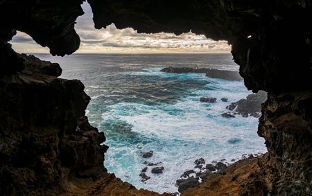 Open cave to the ocean in Easter Islandの写真素材