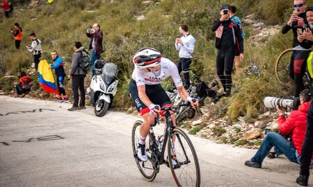 Tadej Pogacar ascending the mountain of Bernia and looking backのeditorial素材