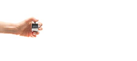 Left hand holding tally counter with text spaceの写真素材