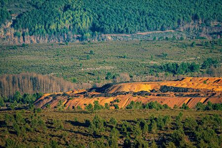 Slate mine in the wild with pine tree forestの写真素材