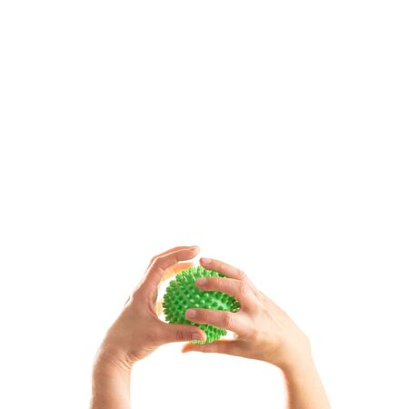 Hands messing around with coronavirus over whiteの写真素材