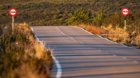 Road in the countryside with no overtaking signsの写真素材