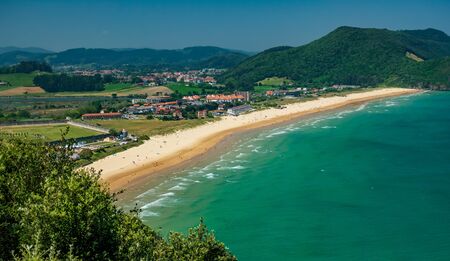 Top view of large beach and small towns in the countrysideの写真素材