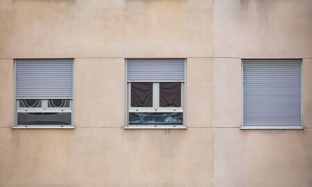 Quarantine home windows in different moods, front viewの写真素材