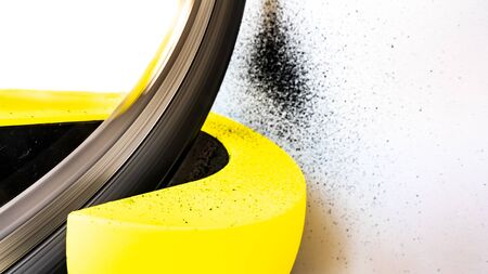 Bike roller and wheel rotating with tyre rubber on the wallの写真素材