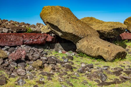 Moai statues laid down on the groundの写真素材