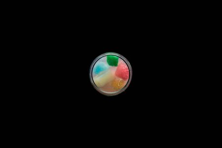 Top view of ice in different colors meltingの写真素材