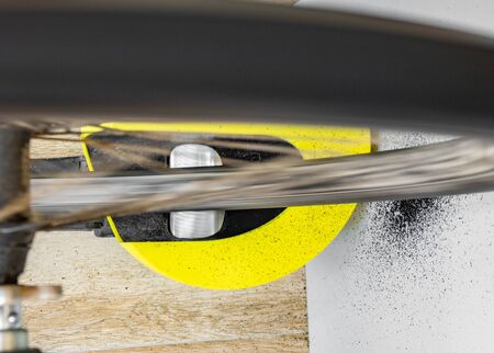 Bike roller and wheel with tyre rubber on the wall, top viewの写真素材