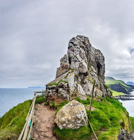 Dangerous track over the cliffs surrounding boulderの写真素材