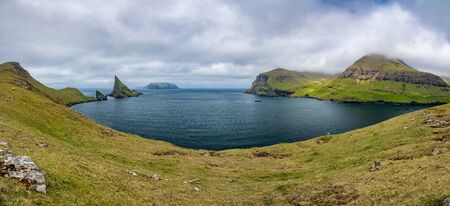 Amazing wide view of Drangarnir gate, Tindholmur and Mykines, Faroe Islandsの写真素材
