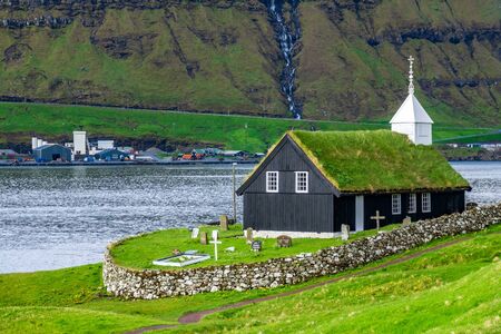Typical church of nordic countries with grass on the roofの写真素材