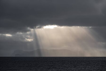 Ray lights over islands at sunset with text spaceの写真素材