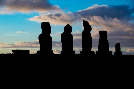 Ahu Tahai moais silhouette at sunset with cloudsの写真素材