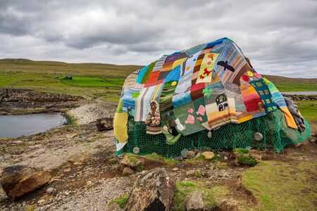 Eldgos and frumskogur the boulder covered with clothes in Sandoyの写真素材