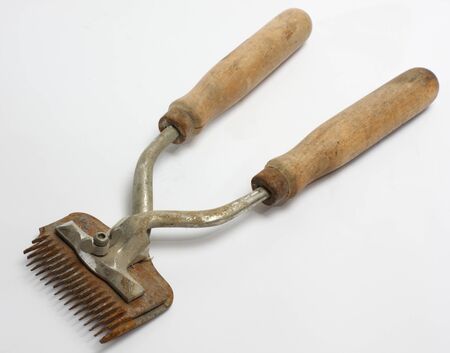 Old rusty machine for haircut over whiteの写真素材