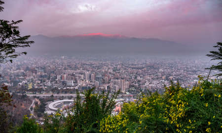 Santiago de Chile downtown at dusk with Andes in the backgroundの写真素材