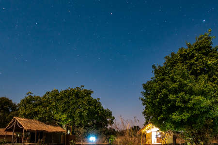 Night view of wooden shacks under the skyの写真素材