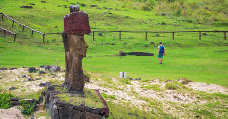 Profile view of moai platform and single touristの写真素材