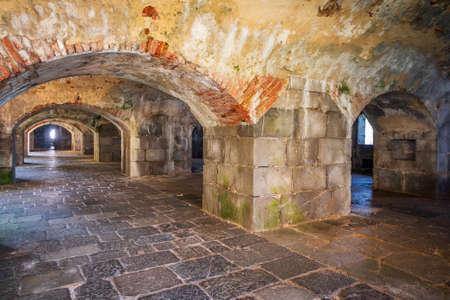 Abandoned fort with many arches and stone floorの写真素材