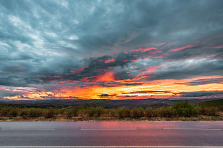 Road in the country spectacular cloudy sunsetの写真素材