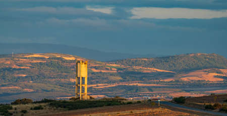 Water tank over the hill near the road