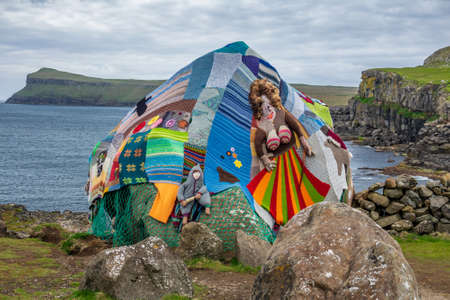 Eldgos and frumskogur, boulder covered with clothes in Sandoyの写真素材