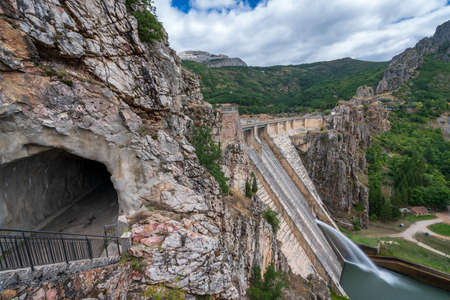 Profile view of dam spillway and tunnel on the roadの写真素材