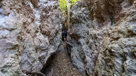 Hiking between narrow pass with huge walls