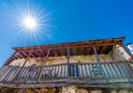 Old vintage wooden balcony under starry sunの写真素材