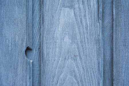 Blue wooden door background with imperfections closeup viewの写真素材