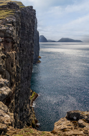 Vertical cliffs over the ocean profile viewの写真素材