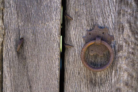 Old doorknocker and doorの写真素材