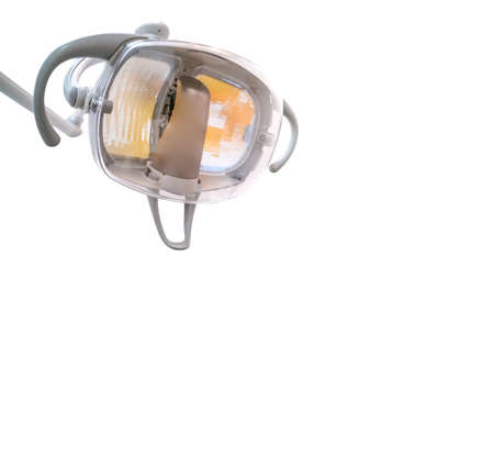 Dentist light over white background for text spaceの写真素材