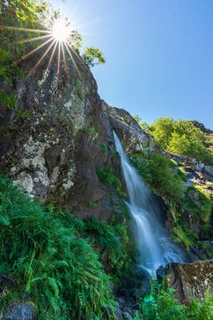 Long exposure of the waterfall and starry sunの写真素材