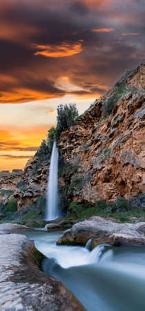 Long exposure of waterfall at sunset timeの写真素材