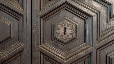 Black wooden door and iron lock backgroundの写真素材