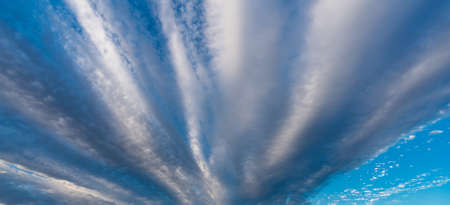 Cloudscape background with deep blue sky, wide angle viewの写真素材