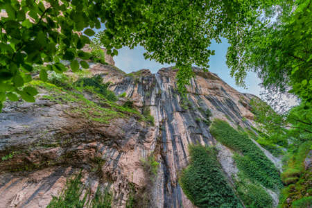 Bottom view of waterfall on huge wallの写真素材