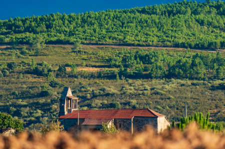 Antique church over the blurred hillsideの写真素材