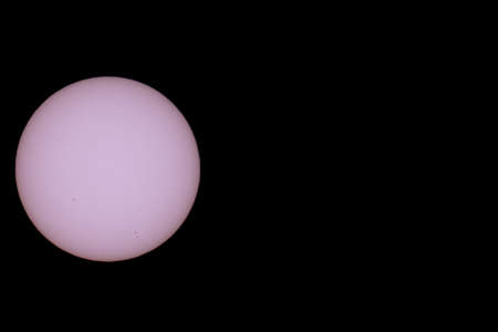 Sun spots close up view against black background for textの写真素材