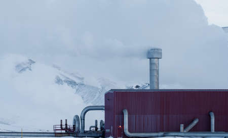 Geothermic plant with clear white smoke and pipesの写真素材