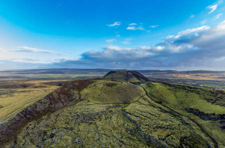 Two volcano craters top view under cloudy skyの写真素材