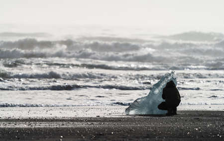 Dark tourist silhouette enjoy diamond beachの写真素材