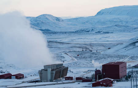 Geothermic plant with with smoke and snow in Icelandの写真素材