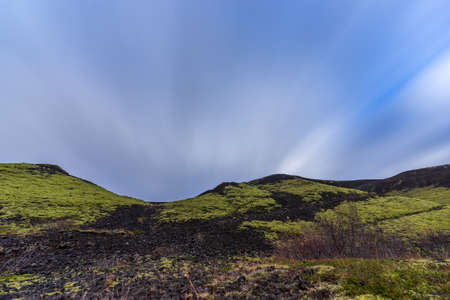 Long exposure with clouds over the volcano craterの写真素材