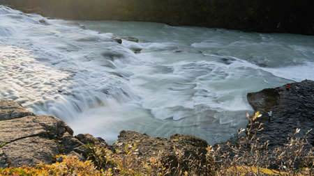 Top view of unrecognizable tourists taking photos to Gullfoss Golden waterfallの写真素材