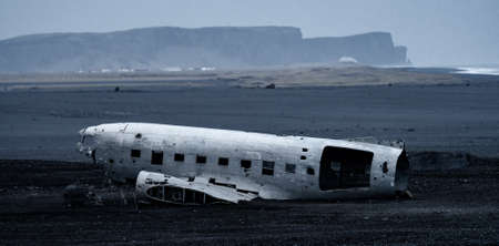 Wreck of and airplane in Iceland against Vik landscapeの写真素材