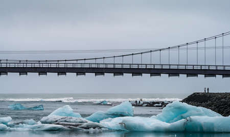 Jokulsarlon bridge, mouth and icebergs on diamond beachの写真素材