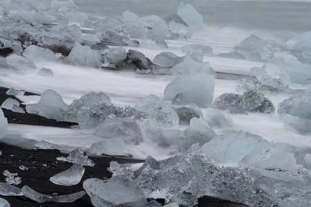Long exposure of icebergs over Jokulsarlon beachの写真素材