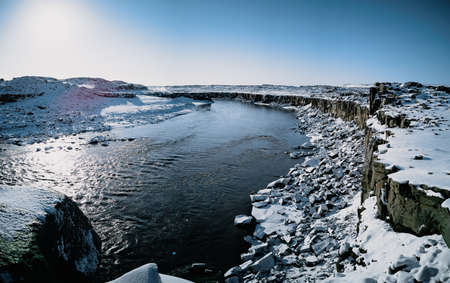 Cube rocks and river with selfoss waterfall in the backgroundの写真素材